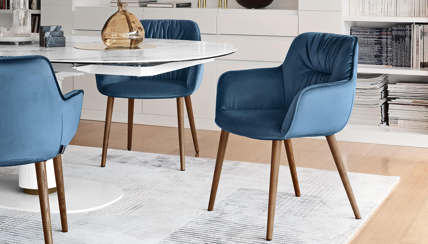 Cocoon: Armchair with plush seat and wooden legs | Calligaris New York