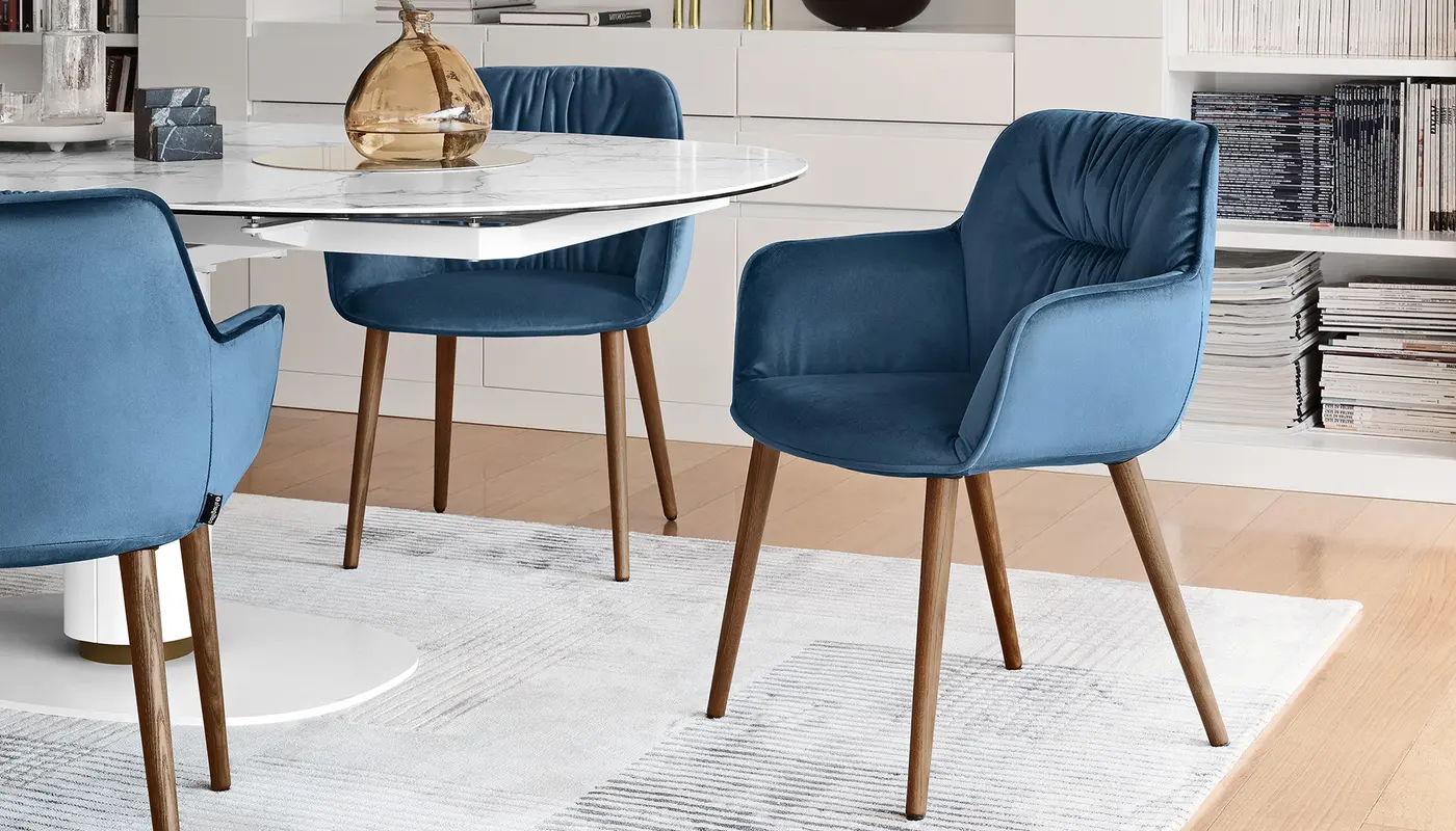 Cocoon: Armchair with plush seat and wooden legs | Calligaris New York