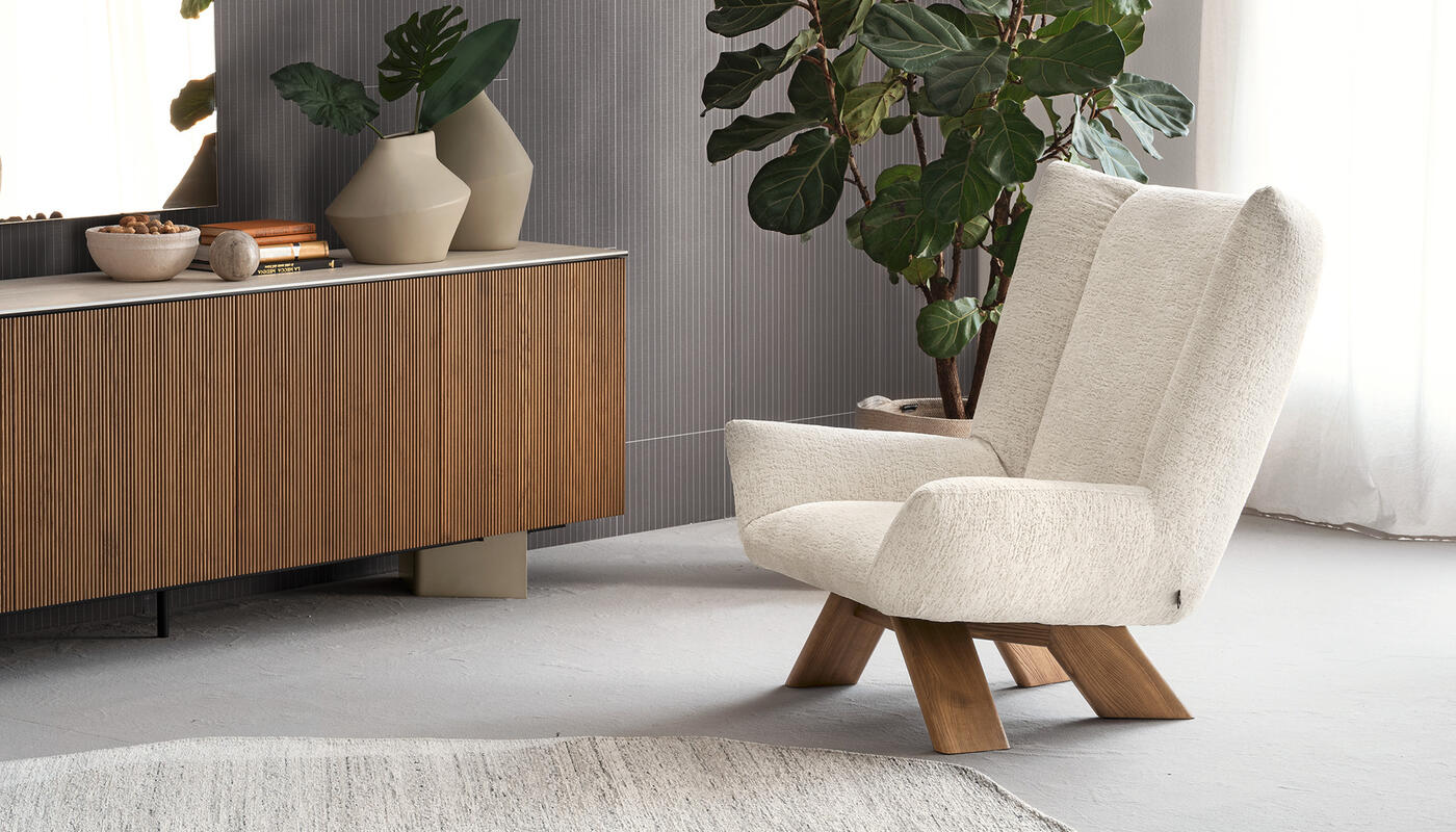 Dalia: Upholstered armchair with wooden base | Calligaris New York