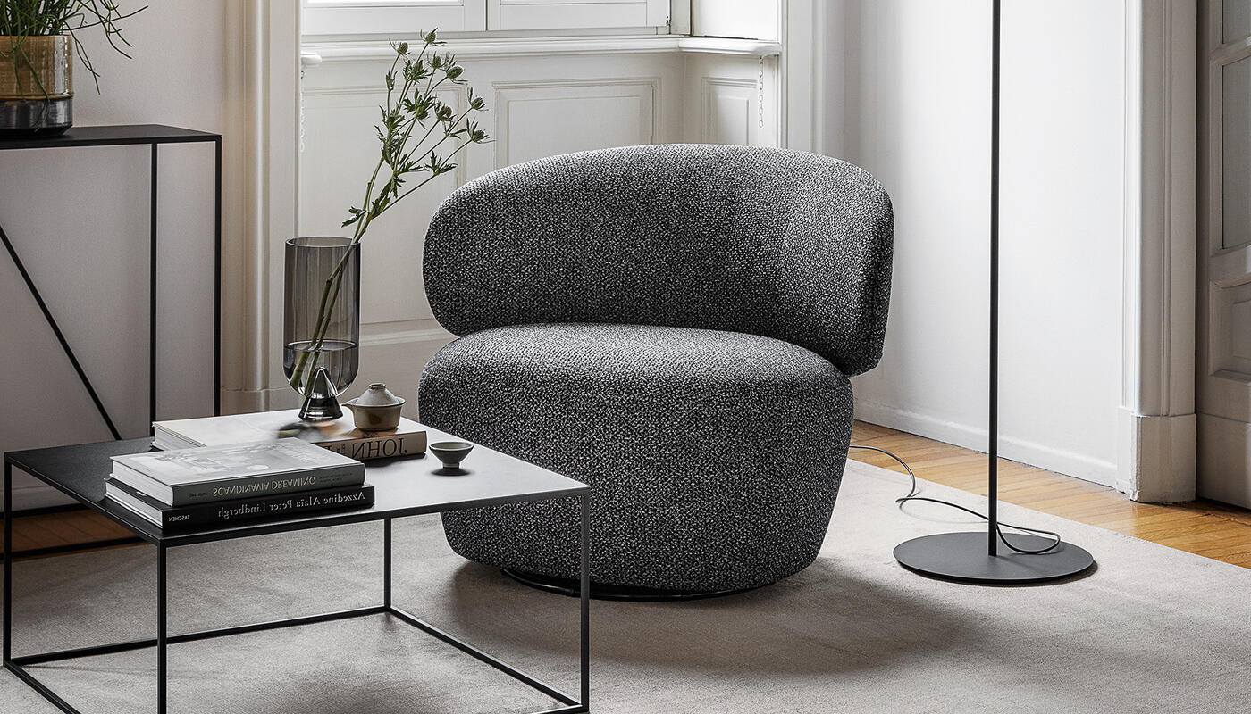 Mara: Plush upholstered armchair with swivel base | Calligaris New